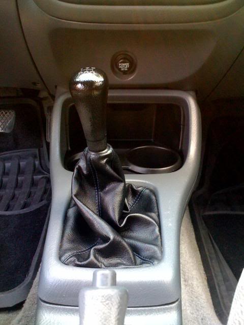 Name:  shiftbootandcupholder.jpg
Views: 35
Size:  37.0 KB